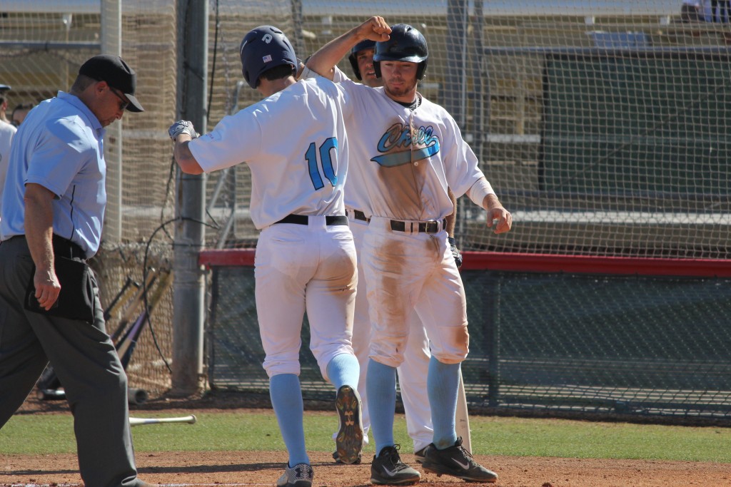 Davis Strong (left) celebrates with Chill teammate Casey Fletcher as his 2-run home run against the Power. Photo by Steve Sitter.